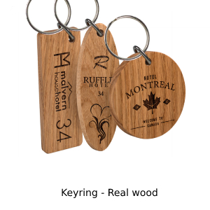 Photo showing 3 different shaped real wood keyrings with branding